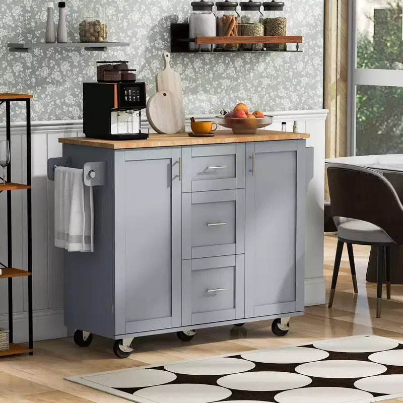 Isola da Cucina con Ruote e Contenitore – Piano in Legno di Gomma, 3 Cassetti e 2 Ripiani Estraibili
